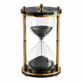 Luxuriöse Sanduhr mit schwarzem Sand und goldenen Akzenten